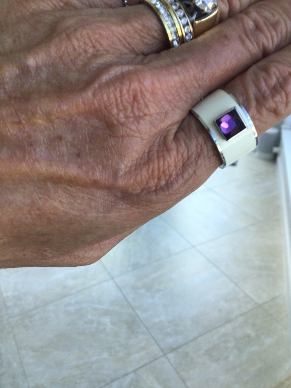 Ring white wide band purple stone